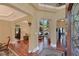 Elegant foyer featuring hardwood floors, arched doorways, and views of the backyard pool at 3590 Fricks Rd, Marietta, GA 30062