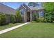 A stunning two-story brick home features a manicured lawn and elegant architectural details at 3590 Fricks Rd, Marietta, GA 30062