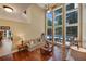 Bright and airy living room with floor-to-ceiling windows and views of the backyard pool at 3590 Fricks Rd, Marietta, GA 30062