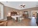 Well-lit primary bedroom with hardwood-style floors, a ceiling fan, and large windows for natural light at 3590 Fricks Rd, Marietta, GA 30062