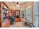 Well-lit home office with custom built-in shelves, desk, and natural light at 3590 Fricks Rd, Marietta, GA 30062