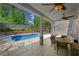 Covered patio area overlooks in-ground pool and includes plenty of shade and a nice outdoor dining area at 3590 Fricks Rd, Marietta, GA 30062
