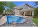 Backyard featuring a large in-ground pool, brick home, covered patio, and a wood pergola covered dining area at 3590 Fricks Rd, Marietta, GA 30062