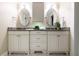 Bathroom featuring a dual vanity with granite counters, cabinetry, and contemporary fixtures at 1440 Hillpine Ln, Atlanta, GA 30306