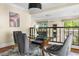 Bright dining room showcasing modern lighting, stylish decor, and a glass-top table with seating for four at 1440 Hillpine Ln, Atlanta, GA 30306