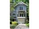 Close up of townhome featuring a small balcony and attached garage at 1440 Hillpine Ln, Atlanta, GA 30306