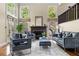 Spacious living room with fireplace, hardwood flooring and stylish furniture at 1440 Hillpine Ln, Atlanta, GA 30306