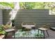 Comfortable patio set with seating for four, decorative rug, and privacy fence at 1440 Hillpine Ln, Atlanta, GA 30306