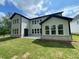 Spacious backyard featuring new home construction, a green lawn, and a patio at 1994 Freestone Way, Marietta, GA 30064