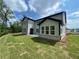 Expansive backyard view of a two-story home featuring a large lawn and brick foundation at 1994 Freestone Way, Marietta, GA 30064