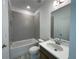 Clean bathroom featuring a tub-shower combo, single sink vanity, and modern fixtures at 1994 Freestone Way, Marietta, GA 30064