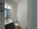 Half-bathroom featuring modern fixtures and finishes, with a stylish vanity and a mirror at 1994 Freestone Way, Marietta, GA 30064