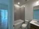 Functional bathroom with a bathtub and shower combination and a neutral color palette at 1994 Freestone Way, Marietta, GA 30064