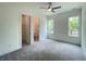 Empty bedroom with natural light, ceiling fan, ensuite access, and neutral walls at 1994 Freestone Way, Marietta, GA 30064