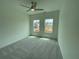 Well lit bedroom with views to the outdoors and comfortable carpeted flooring at 1994 Freestone Way, Marietta, GA 30064