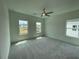 Bright bedroom with plenty of natural light from large windows and neutral carpet at 1994 Freestone Way, Marietta, GA 30064