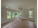 Light-filled bedroom featuring wood floors and several windows offering abundant natural light at 1994 Freestone Way, Marietta, GA 30064