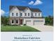 Two-story home featuring a brick exterior, multiple garage bays and professionally landscaped yard at 1994 Freestone Way, Marietta, GA 30064
