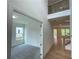 Hallway view with hardwood flooring, two story entry and view to a carpeted room through a doorway at 1994 Freestone Way, Marietta, GA 30064