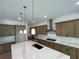 Spacious kitchen with an island, stainless steel appliances, and ample cabinet space at 1994 Freestone Way, Marietta, GA 30064