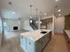 Open-concept kitchen featuring a large island, modern appliances and a seamless flow into the living area at 1994 Freestone Way, Marietta, GA 30064