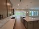 Modern kitchen featuring sleek countertops, herringbone backsplash and stainless steel appliances at 1994 Freestone Way, Marietta, GA 30064