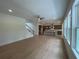Open-concept living room and kitchen with hardwood floors and large windows for natural light at 1994 Freestone Way, Marietta, GA 30064