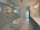 Luxurious bathroom features a stand-alone tub, walk-in shower, and double vanity at 1994 Freestone Way, Marietta, GA 30064