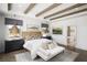 Spacious main bedroom features wood beams, a bench, and a ensuite bathroom at 1994 Freestone Way, Marietta, GA 30064
