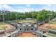 Aerial view of well-maintained baseball fields with covered dugouts and clear blue skies above at 2110 Prichard Park Dr, Kennesaw, GA 30144