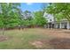 A dog park within the community with green grass, waste stations and a wooden fence at 2110 Prichard Park Dr, Kennesaw, GA 30144