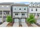 Charming three-story townhomes with stone accents, attached garages, and private balconies at 2110 Prichard Park Dr, Kennesaw, GA 30144