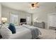 Cozy main bedroom featuring soft carpet, neutral paint, ample lighting, and comfortable furnishings at 2110 Prichard Park Dr, Kennesaw, GA 30144