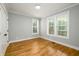 Bright bedroom with hardwood floors, neutral walls, and large windows allowing for natural light at 2805 Pineland Ave, Atlanta, GA 30340