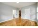 Bedroom with hardwood floors and doors to the bathroom and closet at 2805 Pineland Ave, Atlanta, GA 30340
