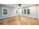 Bright bedroom with three windows, hardwood floors, and light gray walls at 2805 Pineland Ave, Atlanta, GA 30340