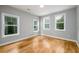 Comfortable bedroom featuring hardwood floors, natural light, and neutral paint at 2805 Pineland Ave, Atlanta, GA 30340