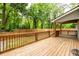 Spacious wooden deck with wood railings and ample space for entertaining at 2805 Pineland Ave, Atlanta, GA 30340