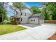 Two-story home with a two-car garage and long driveway, enhanced with a wooden fence at 2805 Pineland Ave, Atlanta, GA 30340