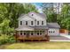 Beautiful two-story home featuring a welcoming front porch and lush green lawn at 2805 Pineland Ave, Atlanta, GA 30340