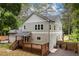 Backyard view of a two-story home with a wood deck and fenced yard at 2805 Pineland Ave, Atlanta, GA 30340