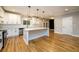 Modern kitchen with white subway tile backsplash, stainless steel appliances, and an open floor plan at 2805 Pineland Ave, Atlanta, GA 30340