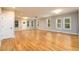 Large living room features beautiful hardwood floors, neutral paint, and abundant natural light at 2805 Pineland Ave, Atlanta, GA 30340