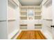 Organized walk-in closet with built-in shelving and drawers at 2805 Pineland Ave, Atlanta, GA 30340