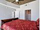 Bedroom featuring a queen bed, carpeted floor, access to the bathroom, and an adjoined living area at 3324 Peachtree Rd # 1719, Atlanta, GA 30326