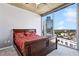 Bedroom with a queen bed, carpeted floor, and a skyline view from the floor to ceiling windows at 3324 Peachtree Rd # 1719, Atlanta, GA 30326