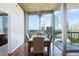 Bright dining room features floor-to-ceiling windows with skyline views and wood floors at 3324 Peachtree Rd # 1719, Atlanta, GA 30326