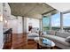 Bright living room featuring hardwood floors, modern furniture, and access to a balcony with stunning city views at 3324 Peachtree Rd # 1719, Atlanta, GA 30326