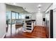 Open-concept kitchen and living room with concrete ceiling, modern cabinets, and floor-to-ceiling windows showcasing city views at 3324 Peachtree Rd # 1719, Atlanta, GA 30326