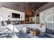 Relax in this stylish lounge with fireplace, TV, bar access, and contemporary decor at 3324 Peachtree Rd # 1719, Atlanta, GA 30326